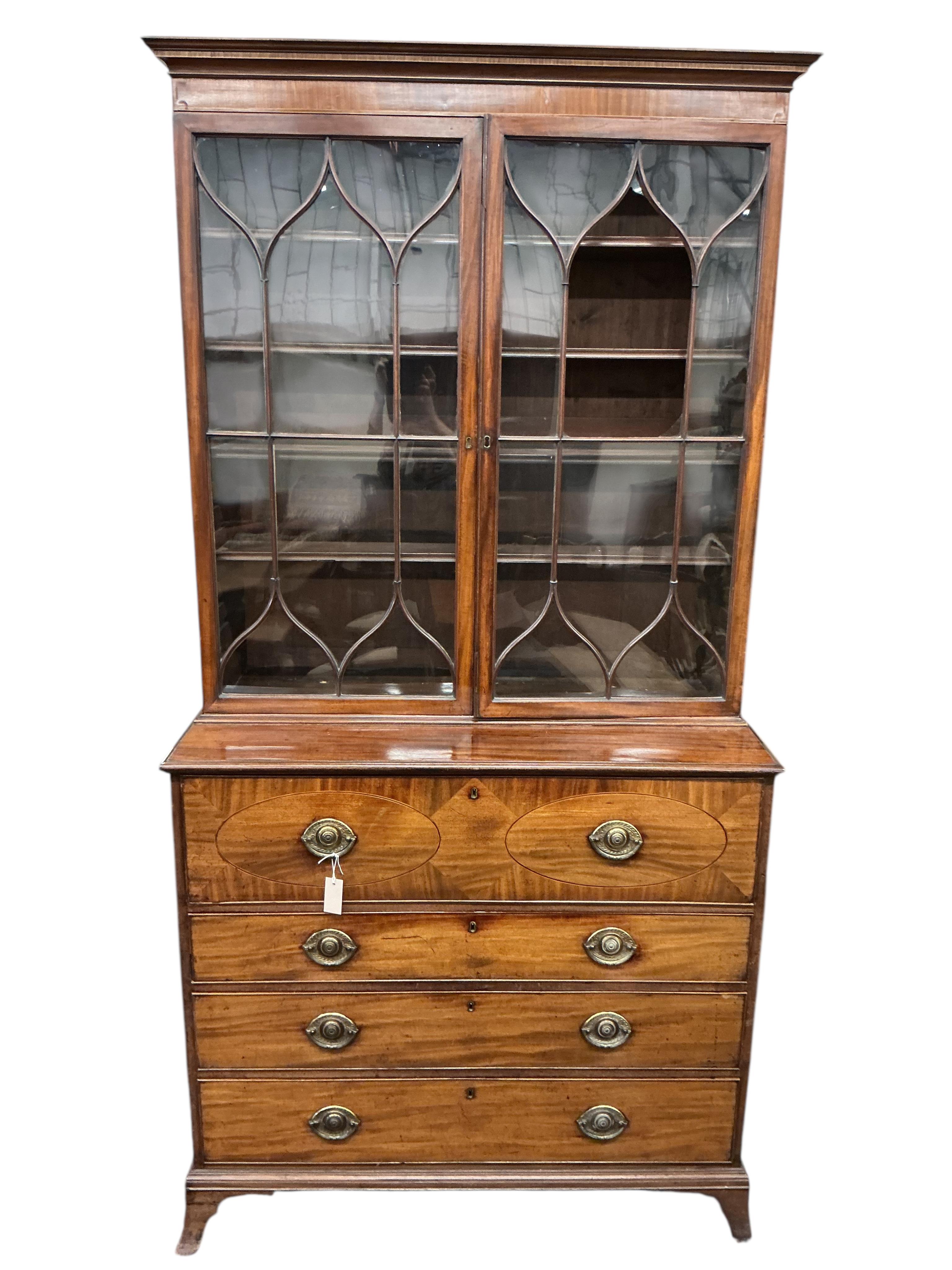 A George III mahogany secretaire bookcase, width 116cm, depth 57cm, height 234cm, one glass pane missing
